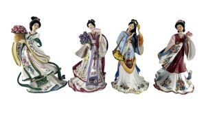 Set of four Danbury Mint figures by Lena Liu