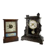 A German and American 19th century 30-hour alarm clock - German Bavarian carved case with a crenella