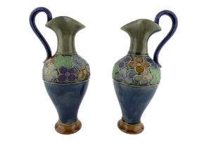 Pair of Royal Doulton stoneware ewers possibly by LF Bowen