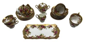 Royal Chelsea Golden Rose pattern tea set comprising eight cups and saucers