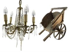 Gilt metal five branch ceiling light hung with lustre drops and a Victorian wooden toy cart