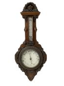 J Hall of Bradford - Early 20th century carved oak-cased aneroid barometer with applied carving to t