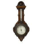 J Hall of Bradford - Early 20th century carved oak-cased aneroid barometer with applied carving to t