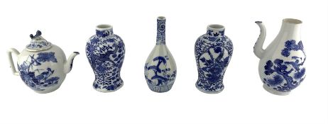 A matched pair of 19th century Chinese blue and white baluster form vases