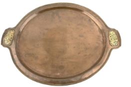 Arts and Crafts oval copper tray attributed to Edward Spencer with pierced brass trailing leaf handl