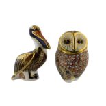 Royal Crown Derby paperweight 'Brown Pelican' with gold stopper and another 'Barn Owl' with silver s