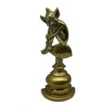Early 20th century brass doorstop modelled as a Pixie seated on a Toadstool