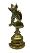 Early 20th century brass doorstop modelled as a Pixie seated on a Toadstool