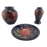 Three pieces of Moorcroft pottery comprising Pomegranate pattern baluster vase H10cm