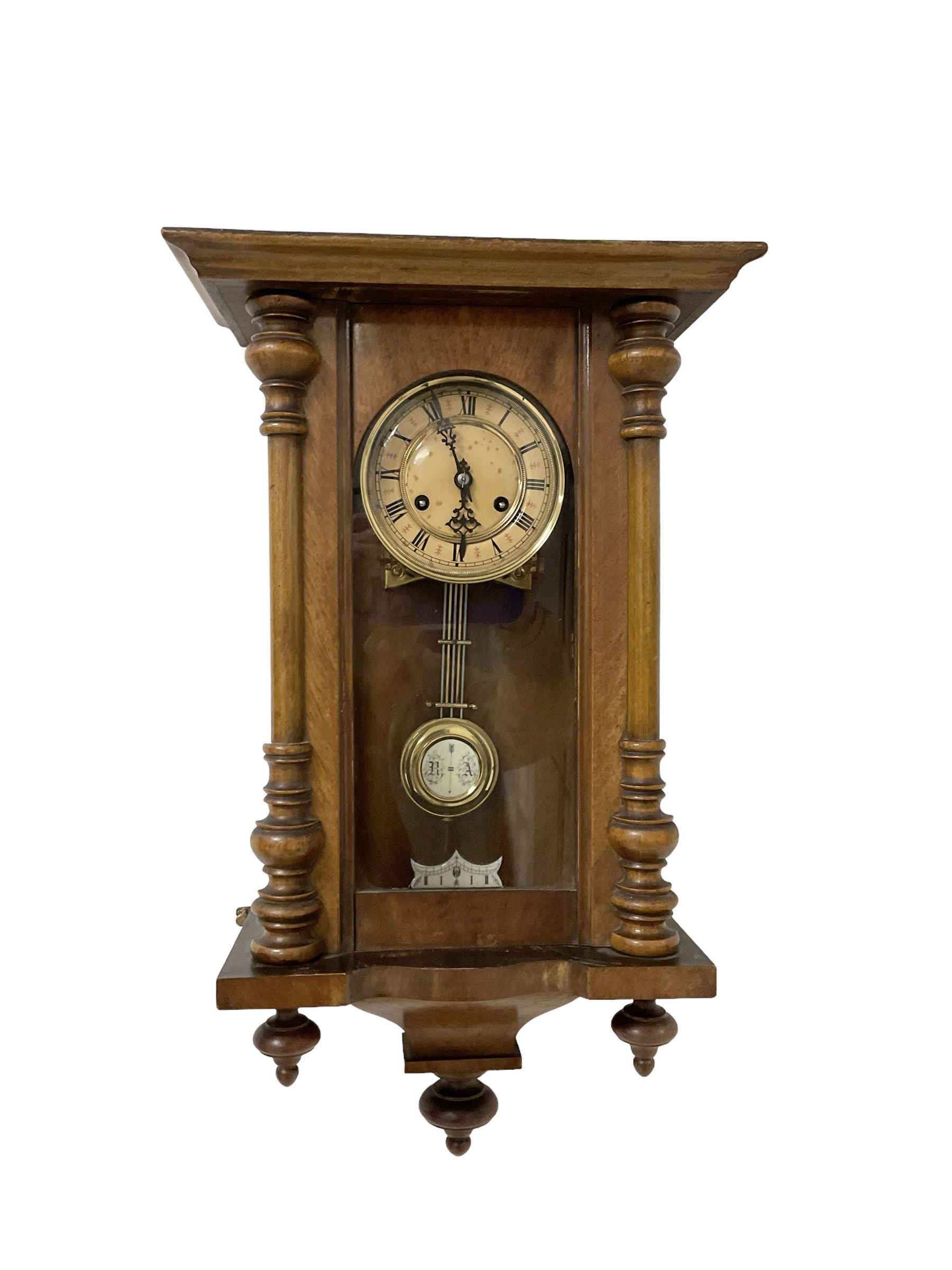 German - 19th-century spring driven wall clock with pendulum and key.