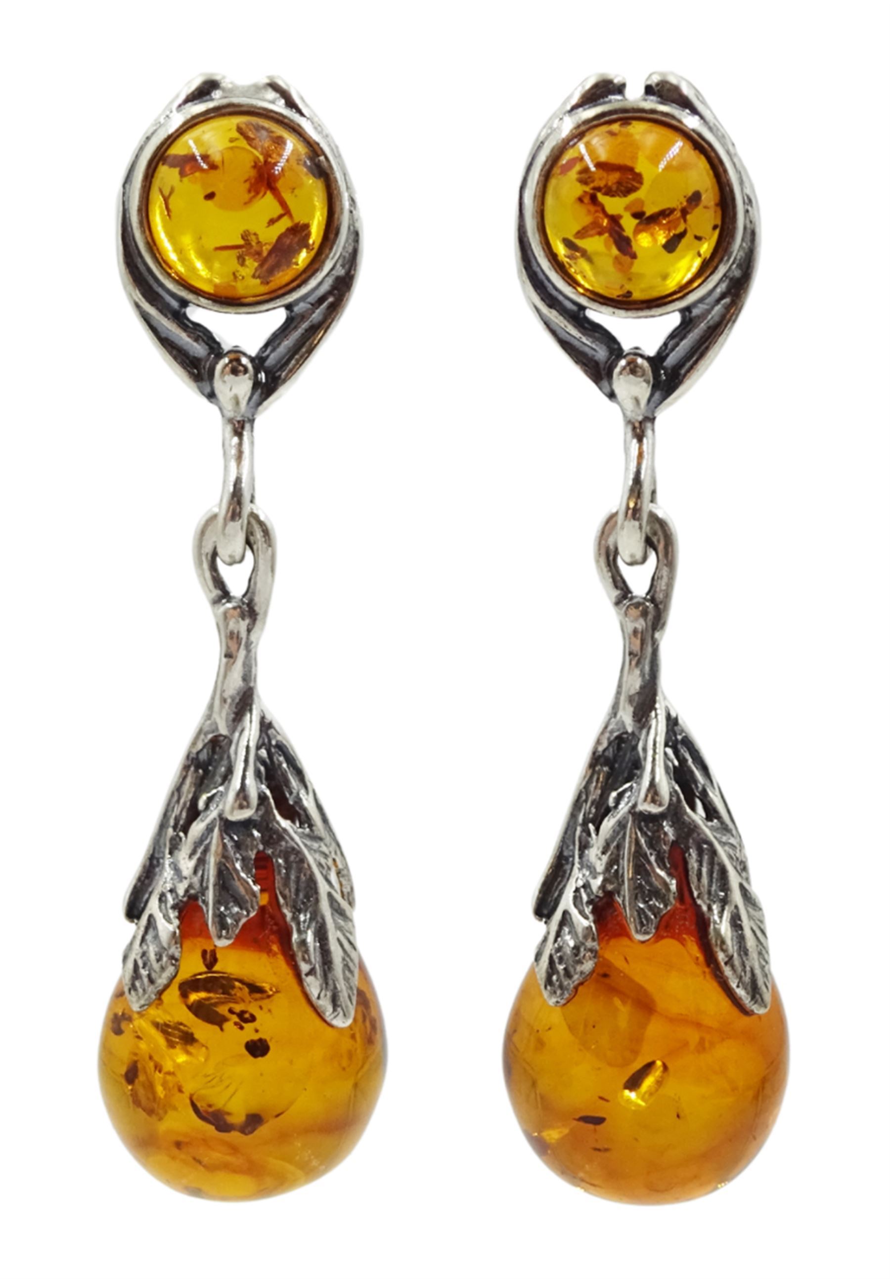 Pair of silver Baltic amber pendant stud earrings