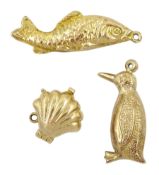 Three 9ct gold charms including penguin