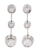 Pair of 18ct white gold graduating three stone round brilliant cut diamond pendant earrings