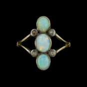 Early 20th century gold three stone opal and four stone diamond ring