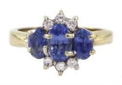 9ct gold three stone oval sapphire and round brilliant cut diamond cluster ring