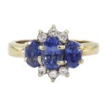 9ct gold three stone oval sapphire and round brilliant cut diamond cluster ring