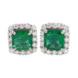 Pair of 18ct white gold square cut emerald and round brilliant cut diamond cluster stud earrings