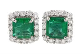 Pair of 18ct white gold square cut emerald and round brilliant cut diamond cluster stud earrings