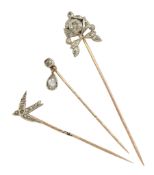 Three Victorian silver and gold diamond stick pins including swallow and an old cut diamond with pe