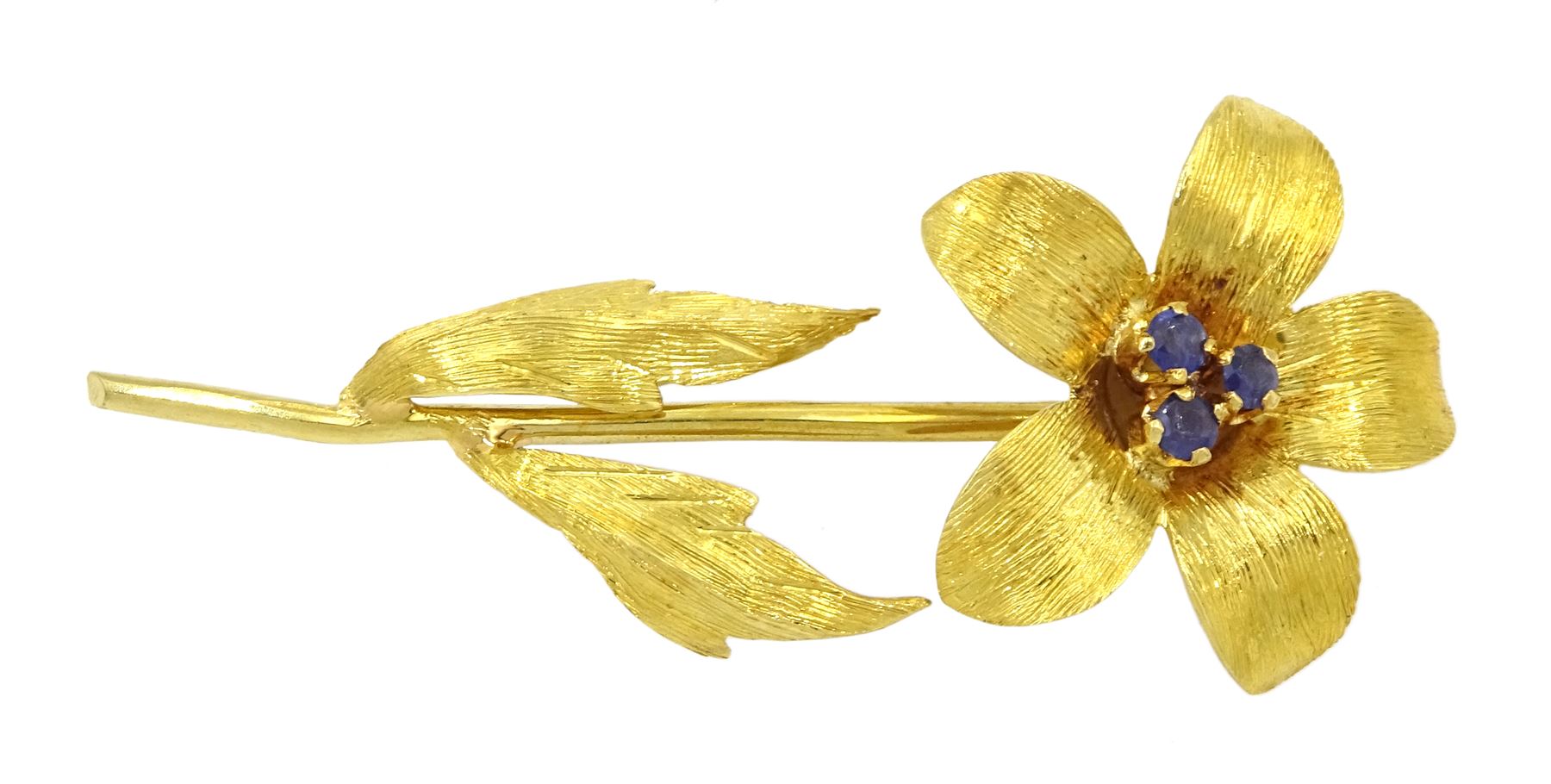 18ct gold flower brooch set with three round cut sapphires