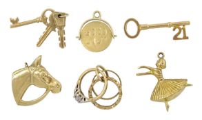 Six 9ct gold pendant/charms including 21 key