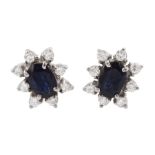 Pair of 18ct gold oval sapphire and round brilliant cut diamond cluster stud earrings