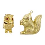 Two 9ct gold pendant/charms including squirrel eating a nut and owl