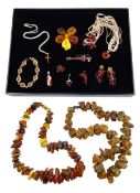 Collection of amber jewellery including silver violin