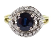 14ct gold oval cut sapphire and round brilliant cut diamond cluster ring