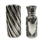 Victorian silver cylindrical scent flask of spiral design with hinged cover and interior glass stopp