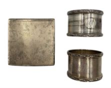 Engine turned square silver powder compact with interior mirror London1946 and two silver serviette