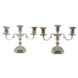 Pair of silver three branch table candelabra with scroll branches and on octagonal bases H21cm Birmi