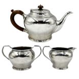 Silver three piece tea set of circular form