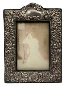Edwardian upright silver photograph frame with embossed floral decoration