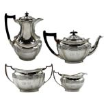 Silver four piece tea set of panelled oval form with gadrooned border