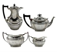 Silver four piece tea set of panelled oval form with gadrooned border