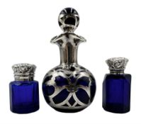 Edwardian blue glass small scent flask of facet cut design with hinged silver cover and interior gla