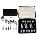 Eleven silver tea spoons with floral finials Birmingham 1939