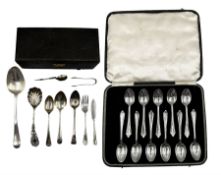 Eleven silver tea spoons with floral finials Birmingham 1939