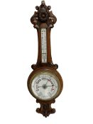 Early 20th century carved oak aneroid barometer - profusely carved top and base with a mercury therm