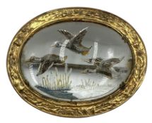 Essex crystal oval Mizpah brooch reverse painted with ducks in flight in a gilt metal frame