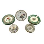 19th century English porcelain plate with panels of flower and fruit sprays reserved on a green grou