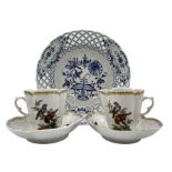 Pair of late 19th century German porcelain chocolate cups and saucers