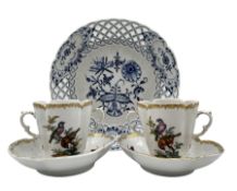 Pair of late 19th century German porcelain chocolate cups and saucers