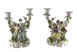 Pair of late 19th/early 20th century German porcelain two branch candelabra with seated female figur