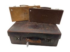 Three vintage attache cases and a leather suitcase by Samuel Taylor