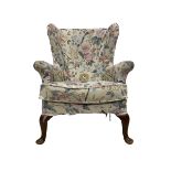 Parker Knoll - wingback armchair upholstered in crimson patterned fabric