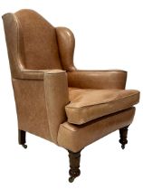 20th century hardwood framed wingback armchair