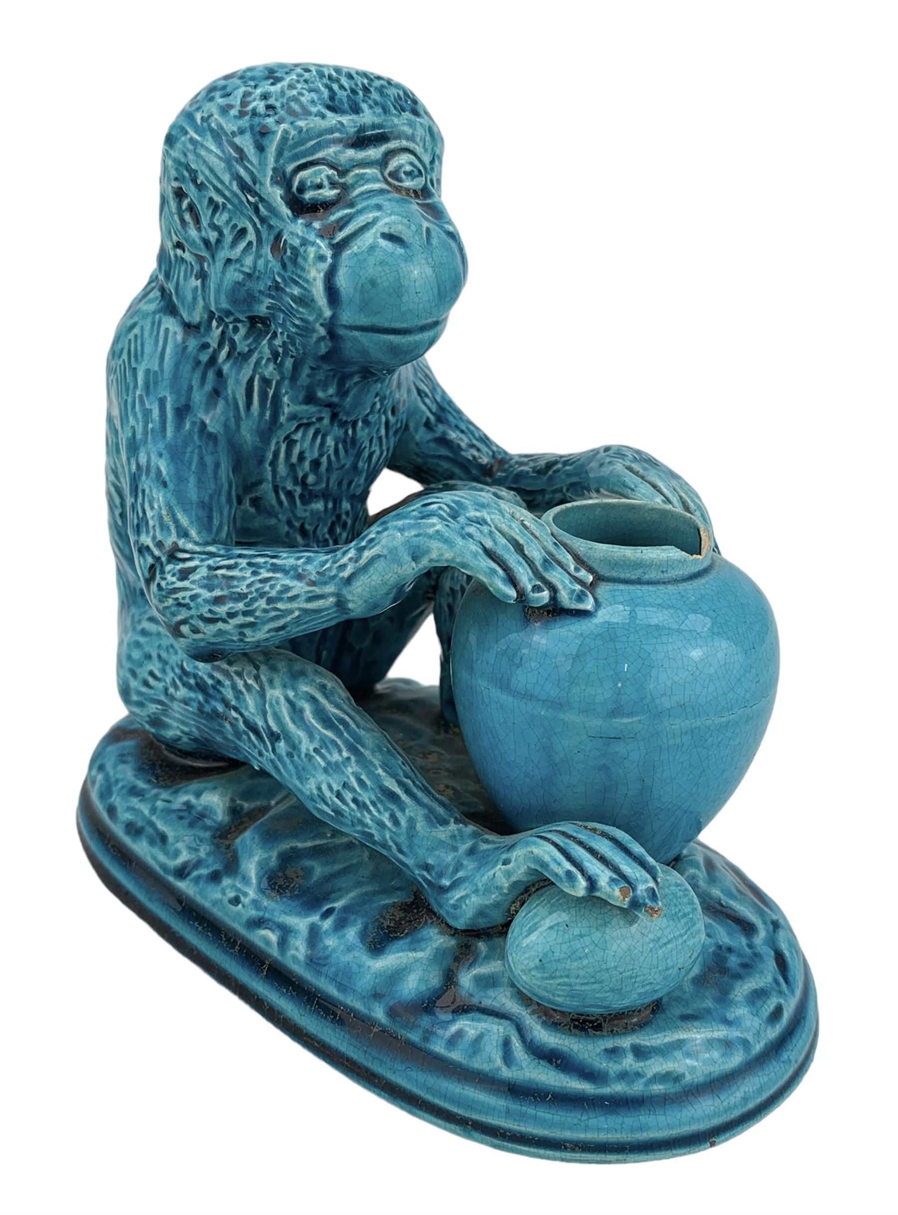 Burmantofts Faience turquoise-glaze model of a monkey