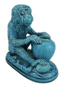 Burmantofts Faience turquoise-glaze model of a monkey